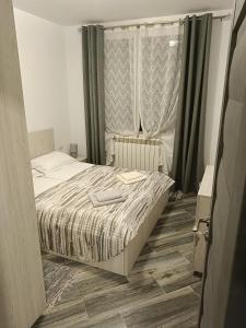 Un pat sau paturi într-o cameră la Residence EOS