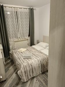 Un pat sau paturi într-o cameră la Residence EOS