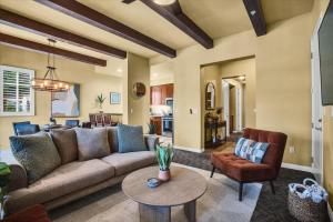 a living room with a couch and a table at Legacy Villas Hideaway overlooking Main Pool #A in La Quinta