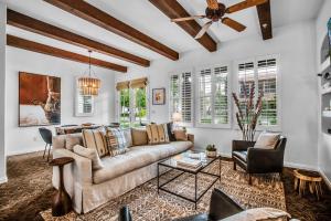 a living room with a couch and chairs at Revitalized Desert Getaway #A in La Quinta
