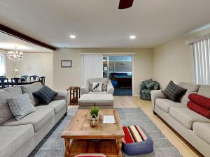 a living room with a couch and a coffee table at The Crows Nest in Ruidoso +41 photos