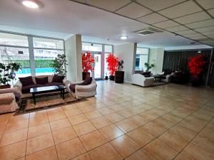 a lobby with couches and chairs in a building at Luisa Lux Apartment - Sat Vacanta in Mamaia