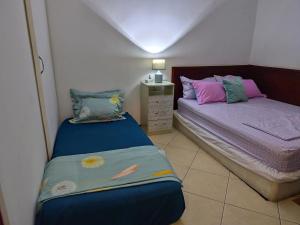 Postel nebo postele na pokoji v ubytování Mendes Family Homestay - B&B In The Heart Of Praia