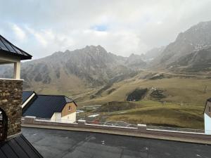 a view of a mountain from the balcony of a house at Résidence Le Pic du Midi - maeva Home - Appartement 2 Pièces 4 personnes - Confort MAE-7631 in La Mongie +1 photo