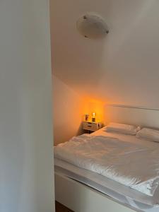 Postel nebo postele na pokoji v ubytování Moderne & stilvolle Wohnung klimatisiert - Messe & Flughafen München