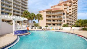 a swimming pool in front of a building at Tides 611 in Destin