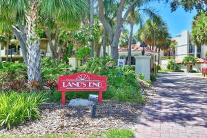 a sign that reads lands end in front of a building at Land's End 5-204 Gulf-Bay Front - Premier in St. Pete Beach