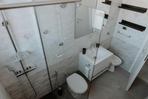 a bathroom with a toilet and a sink and a shower at [Otranto in 10 min]-Free Parking in Maglie +20 photos