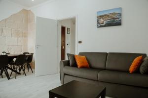 a living room with a couch and a table at [Otranto in 10 min]-Free Parking in Maglie