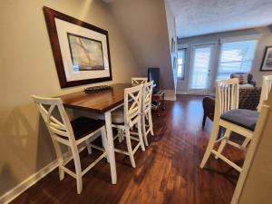 a dining room with a wooden table and chairs at North Shore Inn TC 304 in Traverse City