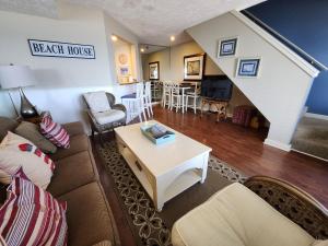 a living room with a couch and a table at North Shore Inn TC 304 in Traverse City