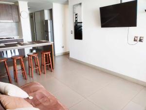 TV a/nebo společenská místnost v ubytování Smart Host Rentals - Vive un Paraíso Frente al Mar