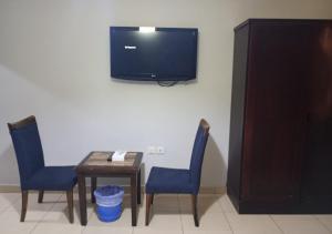 TV o dispositivi per l'intrattenimento presso فندق أصالة الحمراء