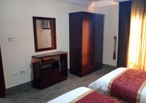 Letto o letti in una camera di فندق أصالة الحمراء