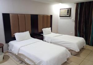 Letto o letti in una camera di فندق أصالة الحمراء