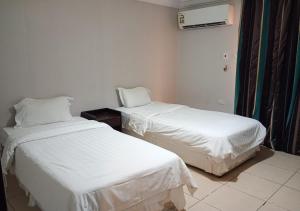 Letto o letti in una camera di فندق أصالة الحمراء