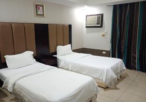 Letto o letti in una camera di فندق أصالة الحمراء