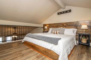 a bedroom with a large bed and a fireplace at Dock Holiday! in Hot Springs