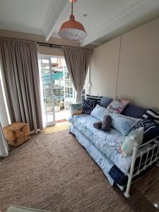 a bedroom with a bed with pillows on it at Seaside Paradise 2 in Kingsborough +43 photos