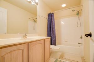 a bathroom with a sink and a toilet and a tub at 54 Mi to Dtwn DC Spacious Family Home! in Nottingham +31 photos