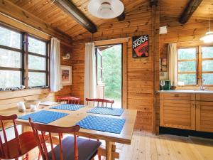 a dining room with a table in a cabin at 4 person holiday home in Store Fuglede-By Traum in Store Fuglede