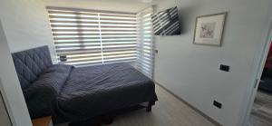 En eller flere senge i et værelse på Departamento Laguna del Mar + 22 billeder