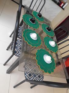 a glass table with cupcakes on top of it at Hotel Ramos in Barreirinhas