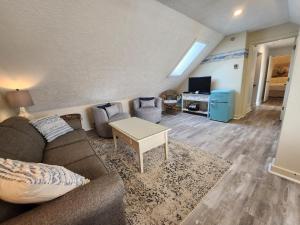 a living room with a couch and a table at North Shore Inn TC 400 in Traverse City