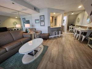 a living room with a couch and a table at North Shore Inn TC 305 in Traverse City