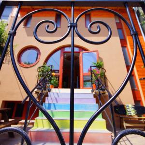 a building with stairs in front of a house at Shantee House in Budapest