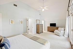 a white bedroom with a bed and a couch at SM14: 14 Silver Moss in Kiawah Island +48 photos