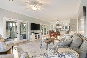 a living room with a couch and a table at SM08: 8 Silver Moss in Kiawah Island