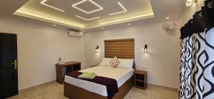 a bedroom with a bed in a room at Marari Beach Bella Casa in Alleppey