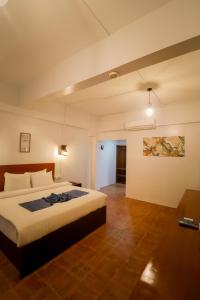 a bedroom with a large bed in a room at Bolabog Beach Resort in Boracay