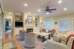 a living room with a table and a fireplace at SM04: 4 Silver Moss in Kiawah Island