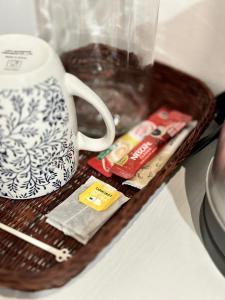 a tray with a coffee mug and a cup at Studio Room at Neu Suites, Jalan Ampang KL in Kuala Lumpur