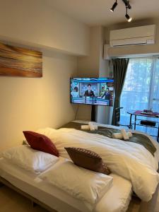 Voodi või voodid majutusasutuse 福屋一番館 toas