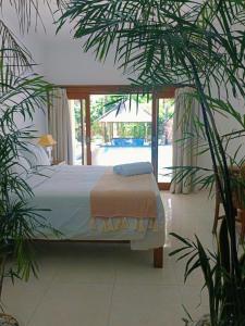 Ένα ή περισσότερα κρεβάτια σε δωμάτιο στο Villa Dunia 400M Pool 2BR