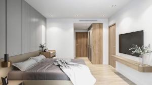 FLC Sea Tower Quy Nhơn-Khách Sạn Mặt Biển-Hồ Bơi Vô Cực-Thanh Apartment في كوي نون: غرفة نوم مع سرير وتلفزيون بشاشة مسطحة