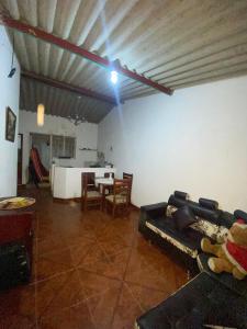 a living room with a couch and a table at Paraiso en el Pueblo in Zetaquira