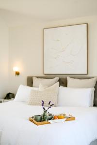 a tray with fruits and vegetables on a bed at Mount Bold Estate - Luxurious Private Retreat in Kangarilla