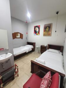 Ένα ή περισσότερα κρεβάτια σε δωμάτιο στο Jeng Tini Guest House
