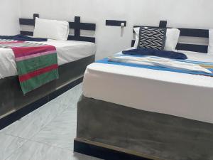 Ένα ή περισσότερα κρεβάτια σε δωμάτιο στο Yashi's Place Sigiriya