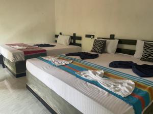 Ένα ή περισσότερα κρεβάτια σε δωμάτιο στο Yashi's Place Sigiriya