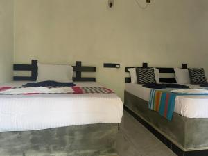 Ένα ή περισσότερα κρεβάτια σε δωμάτιο στο Yashi's Place Sigiriya