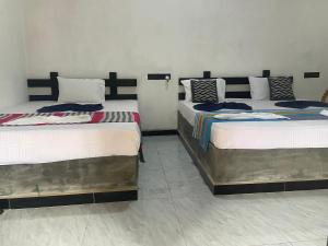 Ένα ή περισσότερα κρεβάτια σε δωμάτιο στο Yashi's Place Sigiriya