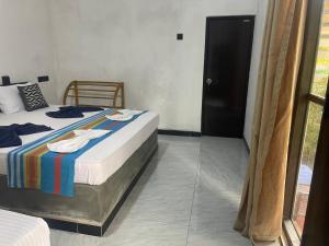 Ένα ή περισσότερα κρεβάτια σε δωμάτιο στο Yashi's Place Sigiriya