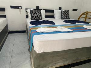 Ένα ή περισσότερα κρεβάτια σε δωμάτιο στο Yashi's Place Sigiriya