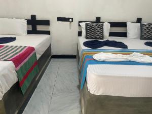 Ένα ή περισσότερα κρεβάτια σε δωμάτιο στο Yashi's Place Sigiriya