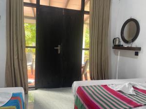 Ένα ή περισσότερα κρεβάτια σε δωμάτιο στο Yashi's Place Sigiriya